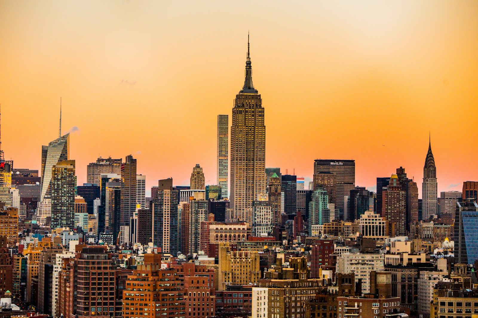 The Manhattan skyline at sunset, with the Empire State Building at the center